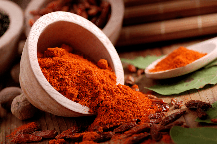 Chili powder in a wooden mortar