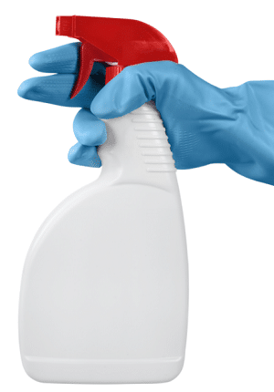 Hand in rubber glove holding a spray bottle
