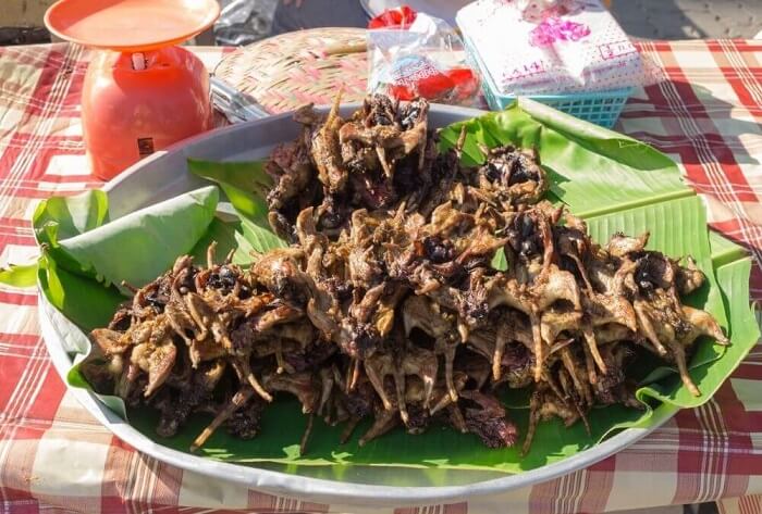 Grilled rat meat on banana leaves